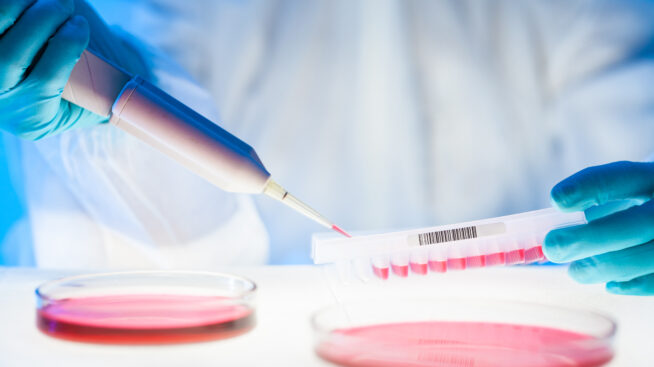 Lab scientist with blood sample