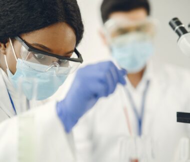 Female and male immunohematologists conducting blood research in the Immunohematology Reference Lab.