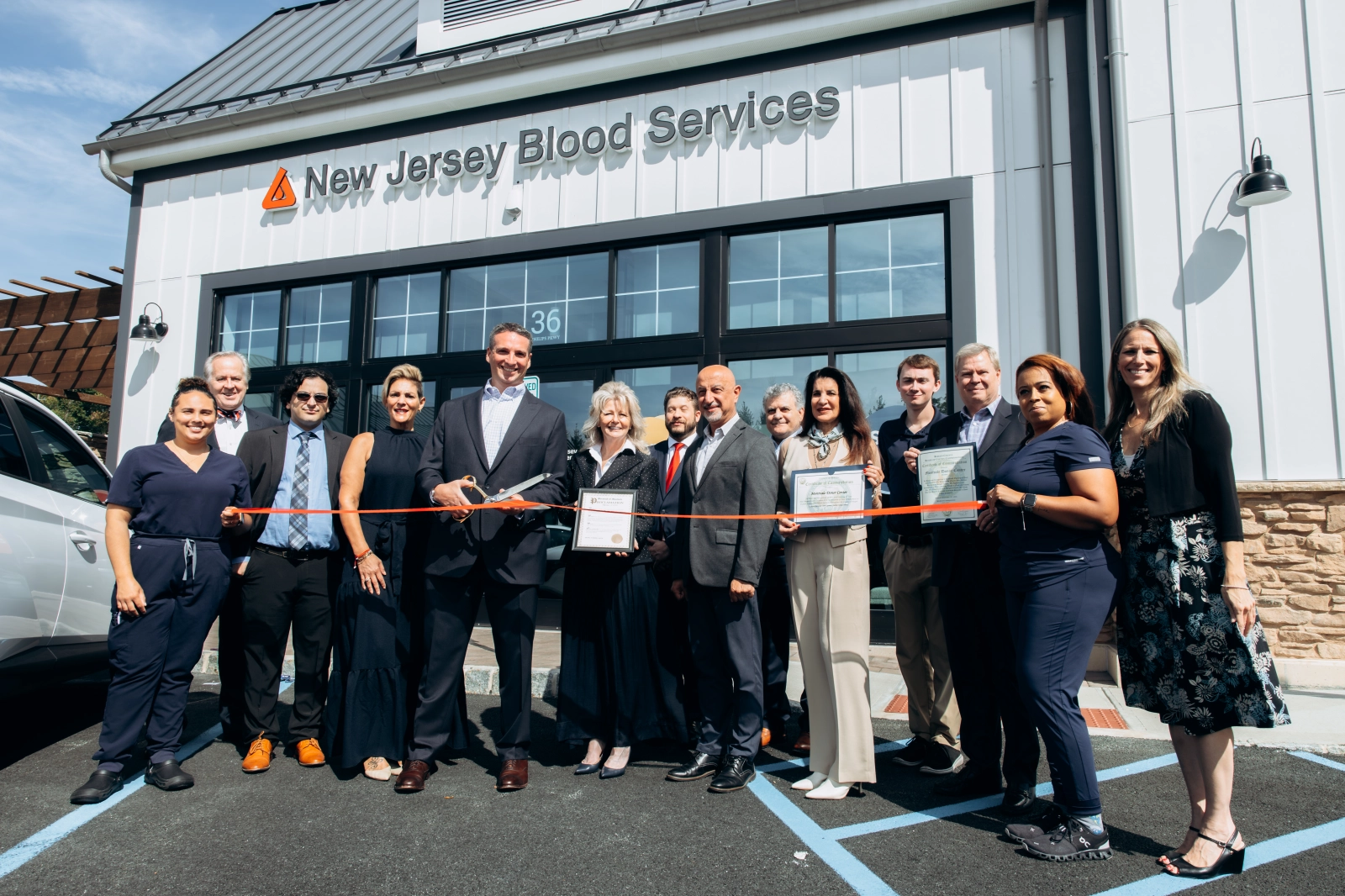 Montvale Mayor Mike Ghassali, Dr. Matthew Letizia the son of blood recipient Gary Letizia and other local community leaders for the grand opening of their new state-of-the-art donor center at 36 Philips Pkwy Unit 103 in Montvale.