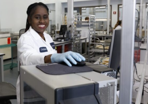 New York Blood Center technician in laboratory smiling.